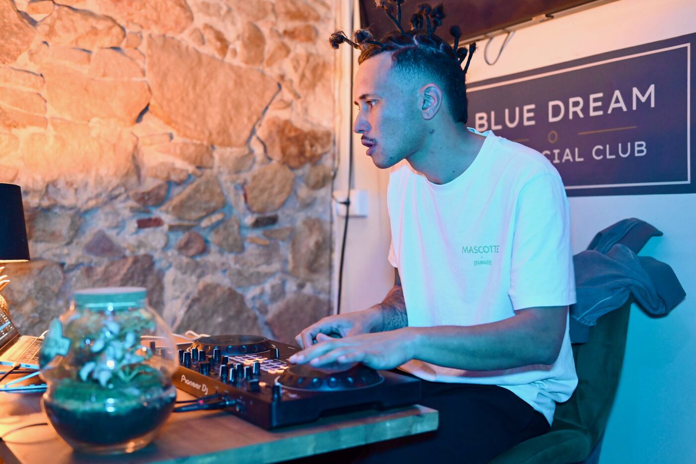 DJ session under the Blue Dream Social Club sign