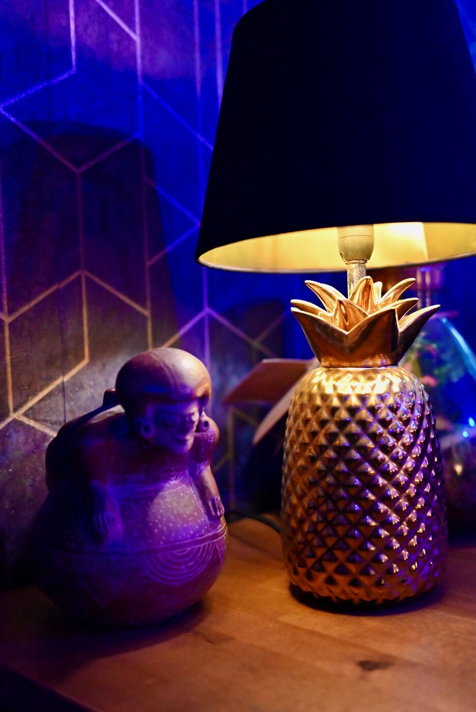 Golden pineapple lamp and decor details at Blue Dream